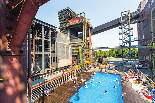 The swimming pool at Zollverein was created in 2001 as part of the art project “Contemporary Art and Criticism” by Frankfurt-based artists Dirk Paschke and Daniel Milohnic. The pool now is a popular meeting point for children and young people in Essen, Germany. People 30 years ago would have scoffed at the thought of holidaying here, says Frank Switala, a local tour guide who works at Zollverein.