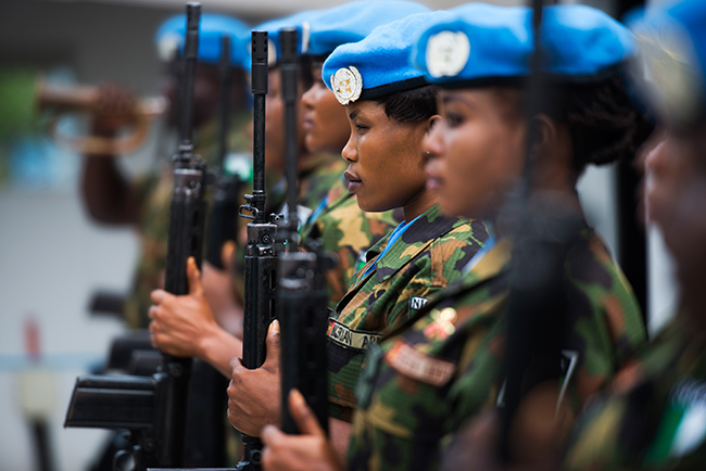 Nigerian peacekeepers serving with the UN Mission in Liberia stand in formation on January 12, 2018, during an inspection at their base. Peacekeeping operations are one of the most visible and tangible tools the United Nations has to implement its peace and security mandate in the field, and they are often the go-to intervention for the international community.