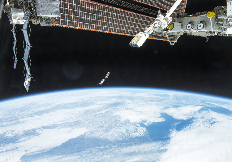 A set of Planet’s Dove satellites, photographed by an Expedition 38 crew member, after being deployed by the NanoRacks Launcher attached to the end of the Japanese robotic arm on the International Space Station.